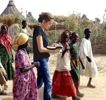 Jolie talking to displaced children in Ardamata camp, West Darfur.